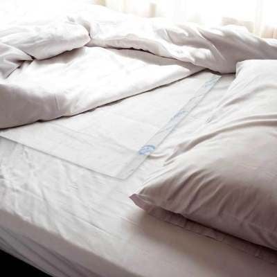 NorthShore&rsquo;s MagicSorb Air Underpads on bed