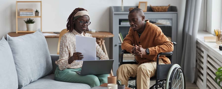 woman reviewing documents with loved one