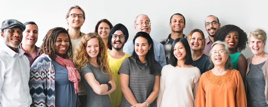 A diverse group of smiling people representing different ages and backgrounds, illustrating key statistics and facts about incontinence.